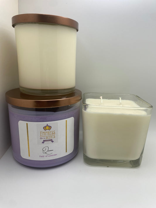 one cylindrical candle jar with white candle wax, one cylindrical candle jar with lavender candle wax, one cube-shaped candle jar with white candle wax